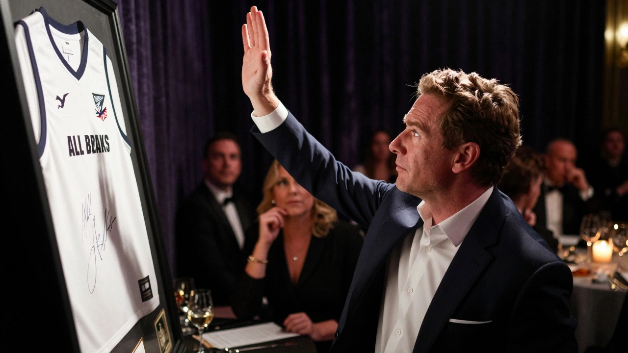 A bidder raising their hand in excitement as a signed sports jersey is auctioned off.